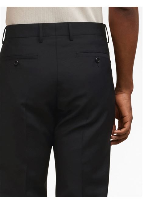 Pantaloni Chino affusolati con pieghe in nero - uomo AMI PARIS | HTR004WV0028001